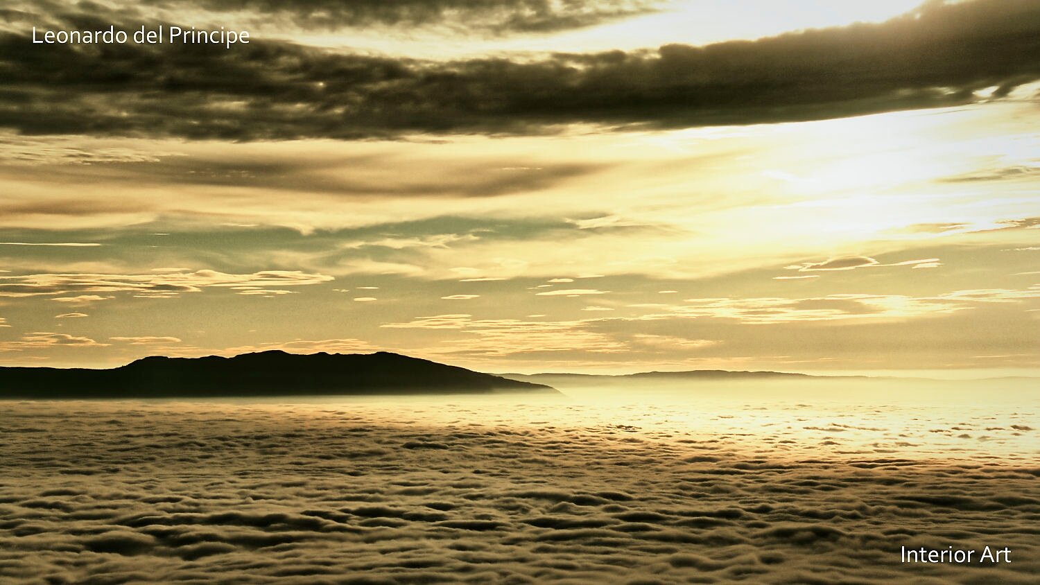 PUMO03 Sunset sky with golden clouds blankets the landscape, creating a serene and dreamy atmosphere with distant dark hills on the horizon.