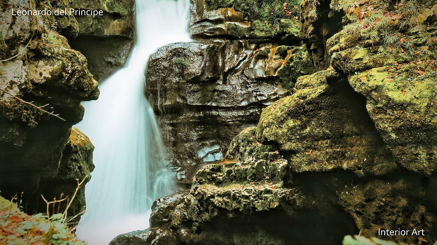 SINK01 A serene waterfall cascades over moss-covered rocks in a lush forest, creating a tranquil and calming atmosphere. The scene is captured with rich green tones.