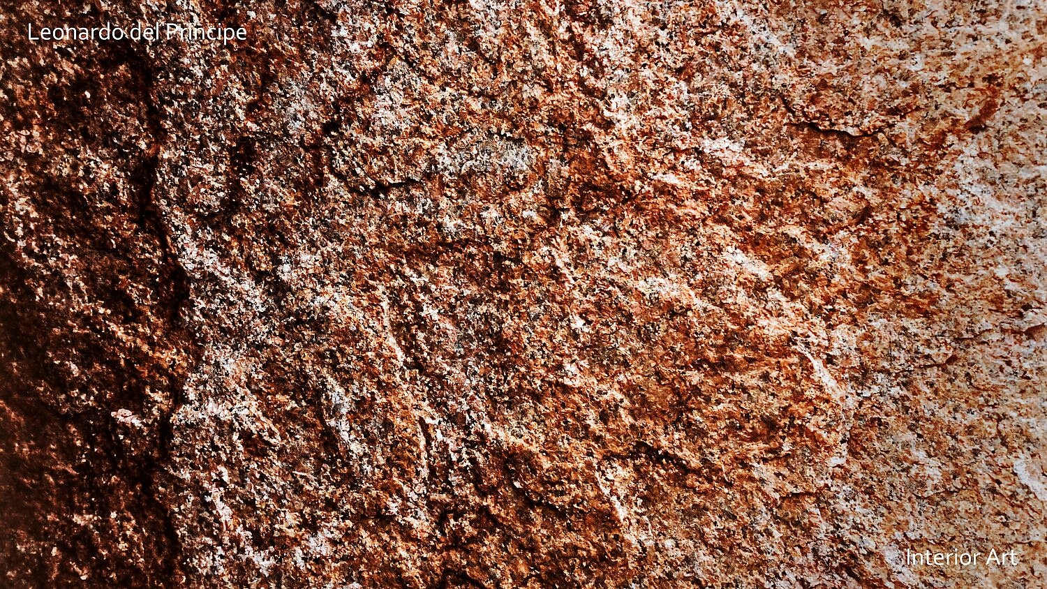 ABGR03 Close-up of a textured, rusty brown granite surface with rough, uneven patterns. The image conveys an earthy and rugged tone.
