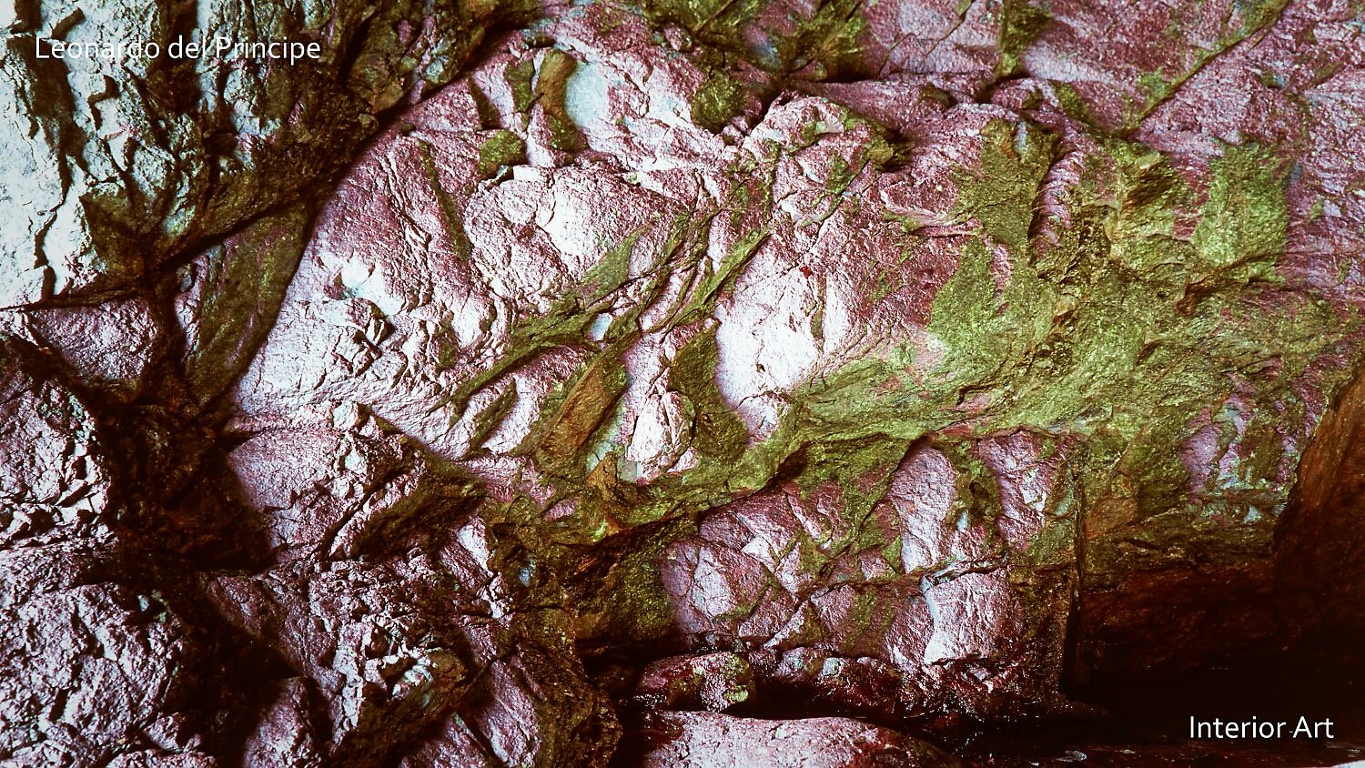 EGRT02 Rough textured rock surface in shades of pink and green, resembling abstract art. The image has a natural, earthy tone and intricate details.